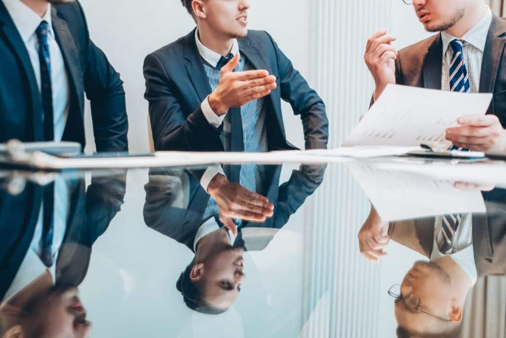 A professional photo of a high-rise apartment complex with visible building manager signage or a clipboard:checklist in focus — something that communicates contract oversight or compliance management