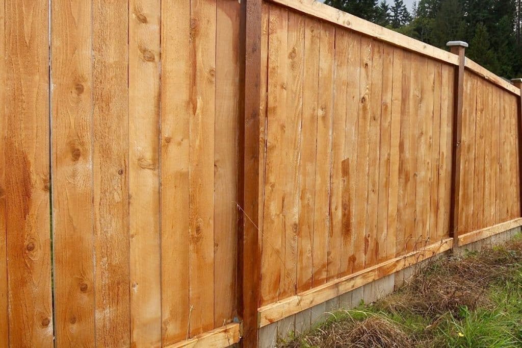 who pays for boundary fence replacement between lot and common property qld